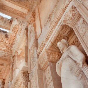 Ceiling of historical Celsus Library of Ephesus city with antique sculpture at entrance, Turkey. Greek city Ephesus founded on 10th century BC.