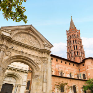 Basilica of Saint-Sernin, Toulouse, France. The Basilica of Saint Sernin in Toulouse is the largest Romanesque church in Europe. The church constructed with local red brick and white stone in the 11th century. Nowadays the church is a UNESCO World Heritage Site.